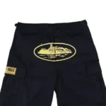 Corteiz-Guerillaz-21′-Shorts-Black-Yellow.webp